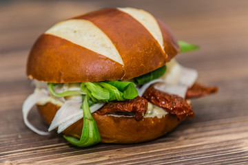 Fresh baguette sandwich on wooden background. Classic BLT sandwiches. Close up.