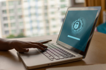 Using a laptop to connect to a network and is protected by a network security system. Warm colors