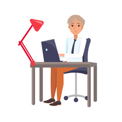 Fototapeta premium Male Sitting at Workplace and Typing on Laptop