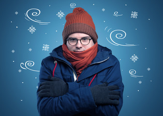 Young hipster frozen boy with doodled snowflakes and windy concept

