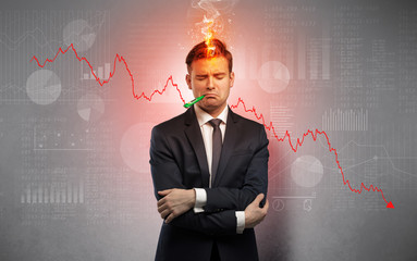 Young sick businessman with decreasing performance concept
