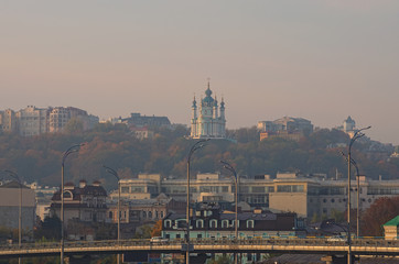 Picturesque view of St. Andrew's Church at the hill and one of the oldest district in Kyiv ? Podil...