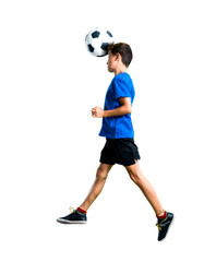 A full-length shot of Boy playing soccer hitting the ball with the head on isolated white background