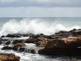 Ocean waves splashing off rocks