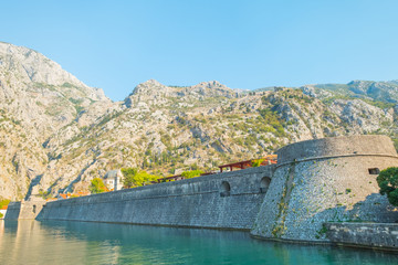 Obraz na płótnie Canvas Kotor, Montenegro. Old fortress of Kotor, Montenegro in late Autumn. Tower and wall, mountain at the background