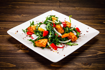 Caesar salad on wooden table