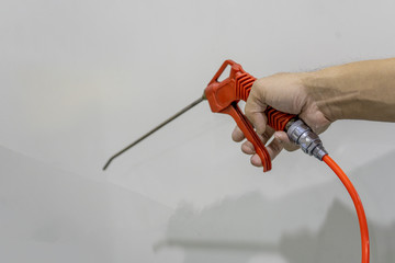 Air blow gun of orange use handle keep.