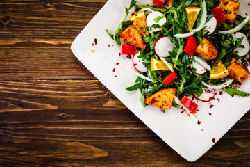 Caesar salad on wooden table