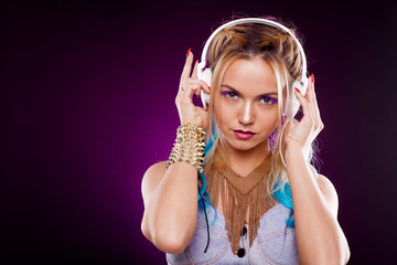 Fototapeta premium Young fashionable girl in disco style. Listening music and enjoying. Retro style