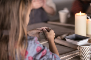 Little boy sculpts from clay with interest