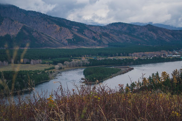 Autumn mountain forest landscape with roads and rivers