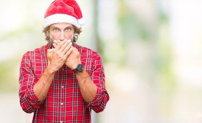 Handsome hispanic man model wearing santa claus christmas over isolated background shocked covering mouth with hands for mistake. Secret concept.