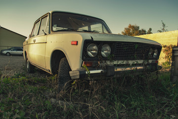 Old broken overgrown Soviet car