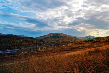 Autumn mountain forest landscape with roads and rivers