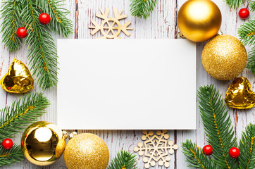 Christmas tree branches, blank paper with decoration.