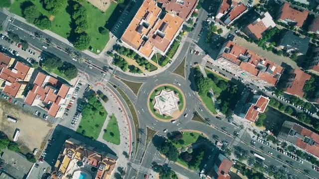 Aerial top down view of urban roundabout traffic in Cordoba, Spain