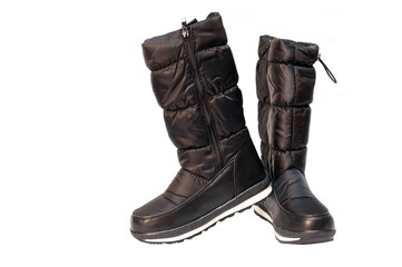 High black winter boots for a girl or woman on a white background are isolated