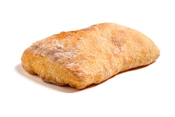 Single whole traditional italian wheat bread ciabatta cooked with olive oil. Nobody. Isolated on white background