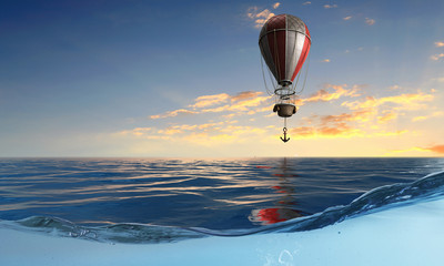 Air balloon over water. Mixed media