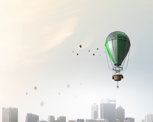 Fototapeta na wymiar Air balloon in blue sky. Mixed media