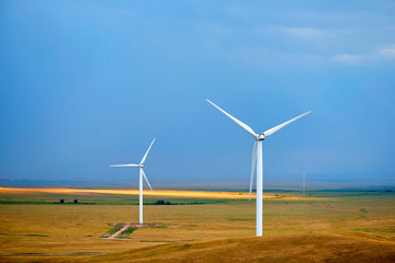 Fototapeta premium Wind power stations. A wind farm is a group of wind turbines in the same location used for production of electric power.