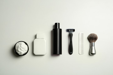 Flat lay composition with shaving accessories for men on white background