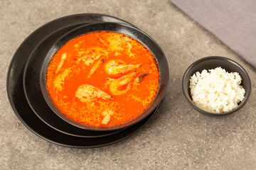 Thai spicy-sour soup Tom Yam with shrimp