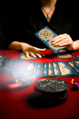 tarot reader with cards, crystal ball and magic pentagram like concept of astrology and fortune...