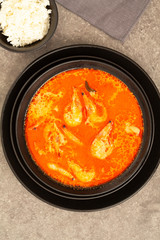 Thai spicy-sour soup Tom Yam with shrimp