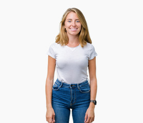 Beautiful young woman wearing casual white t-shirt over isolated background with a happy and cool smile on face. Lucky person.