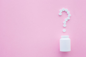 Close up of pills. Dietary supplements. Variety pills. Vitamin capsules on pink background