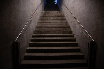 Stairs. subway staircase old in dark night secluded, concrete stairs in the city, stone granite stair steps often seen on monuments and landmarks, going up. Architectural details interiors 