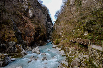 Tolmin Gorge (Tolminska Korita, Korita Tolminke) is a narrow canyon in Julian Alps, close to Tolmin, Soča Valley, Slovenia. Within the gorge is a clear stream with a number of rapid and waterfalls. 