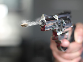 man with hand gun pistol rubber attack violence photomanipulation