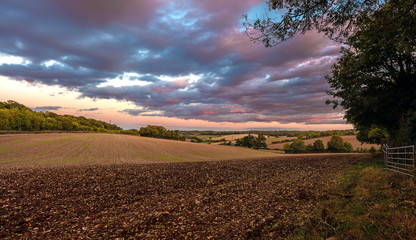 British landscape during sunset with blue and pink clouds