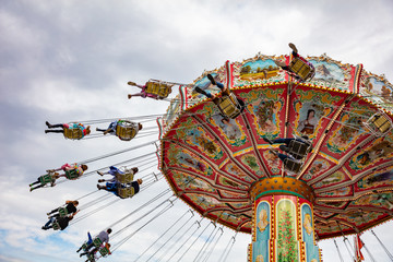Carousel on cloudy sky background. Oktoberfest, Bavaria, Germany © Rawf8