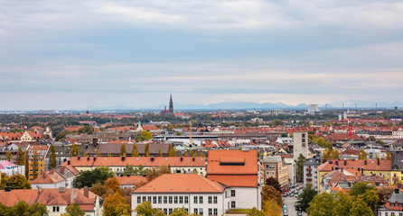 Fototapeta na wymiar Munich city aerial view on cloudy sky background, Bavaria, Germany