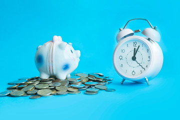 business financial ideas concept with coins and alarmclock isolate background with free copyspace...