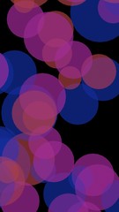 Multicolored translucent circles on a dark background. Vertical image orientation. 3D illustration