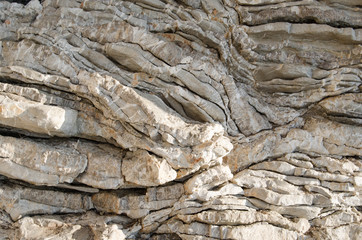 Rock, the background of the layers of ancient sediments.