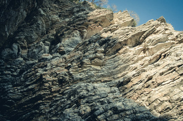 Rock, the background of the layers of ancient sediments.