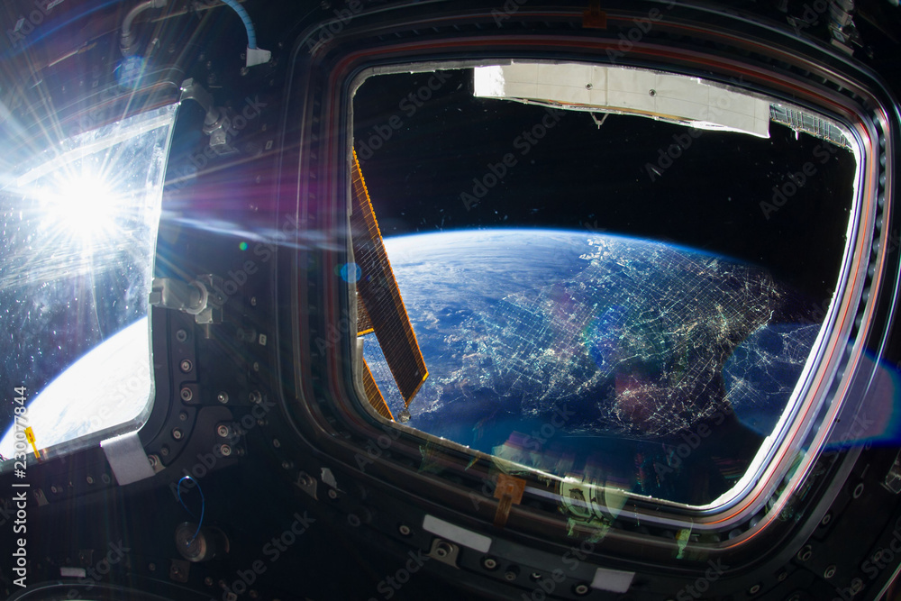 Canvas Prints collage image with huge la city at night with city lights from the outer space from the iss window. 