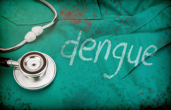 Dengue word written with white paint on a doctor's uniform next to stethoscope, conceptual image