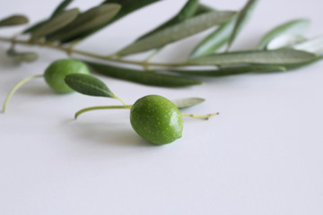 Fresh green olives isolated on white background close up. Concept healthy lifestyle.Blurred background.