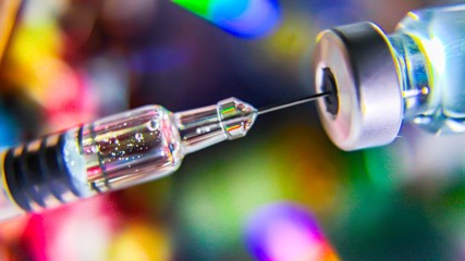 Vaccine vial dose flu shot drug needle syringe,medical concept vaccination hypodermic injection...