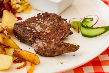 Dinner plate - Steak with baked potatoes, grated beets and salad