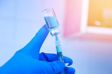 Medical hand glove blue molding vial vaccine hypodermic needle syringe injection treatment.Lab...