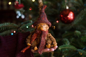 Vintage stuffed monkey toy under the christmas tree