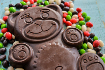 Delicious seasonal Sweets: chocolate figure bears and a lot of candy. The concept of Easter sweets.