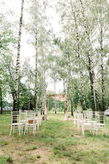 The square arch decorated by fabric of pink color and fresh with flowers